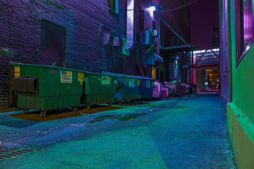 Dumpsters in an alley unorthadoxly color corrected